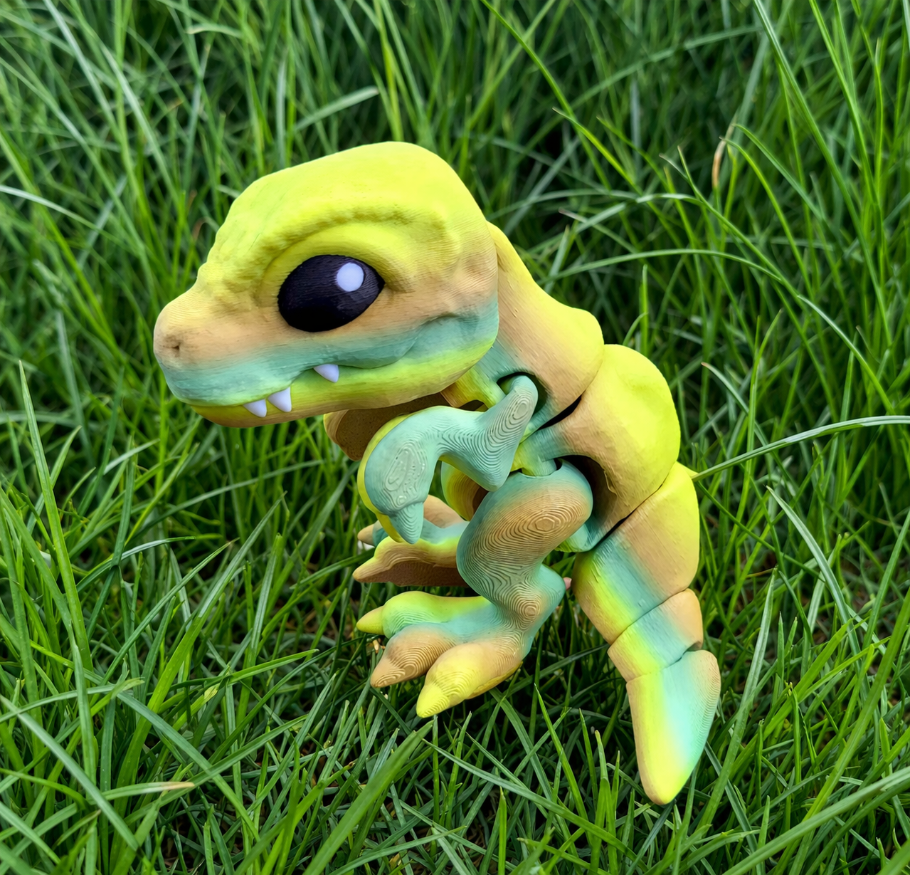 Tiny articulated T-Rex in yellow and mint tones